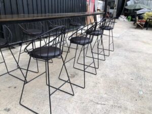 Tall bar table and chairs, black steel frame, wooden top.