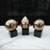Water decoration, golden shape, black marble base.