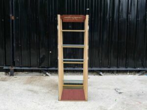 Product shelf Product display shelf, 4 glass shelves, brown wooden frame.