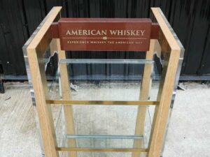 Product shelf Product display shelf, 4 glass shelves, brown wooden frame.