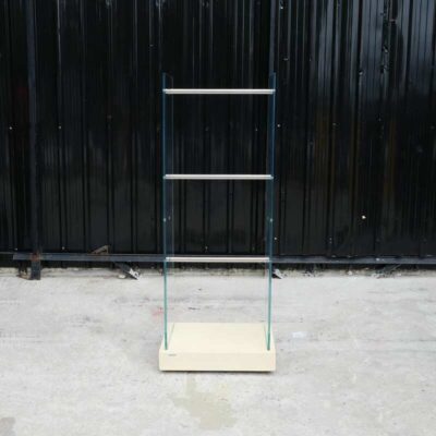 Product hanging rack Product hanging shelf, glass walls on 2 sides, 3 hanging rails, cream colored wooden base.