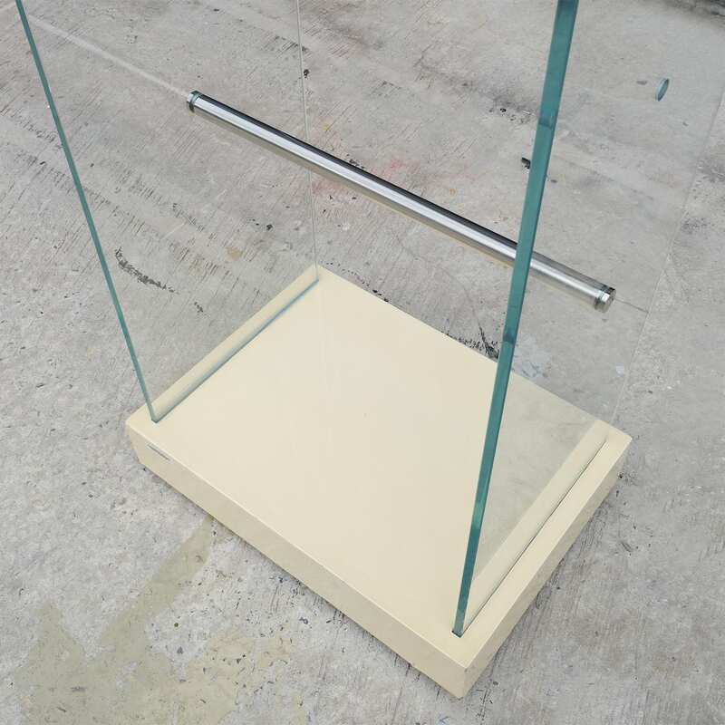 Product hanging rack Product hanging shelf, glass walls on 2 sides, 3 hanging rails, cream colored wooden base.