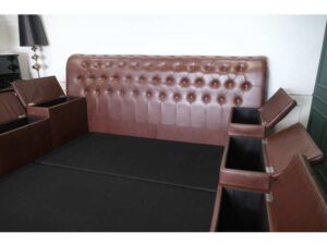 King size bed covered in brown leather There are 8 storage compartments