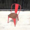 Red steel frame chair with wooden cushion