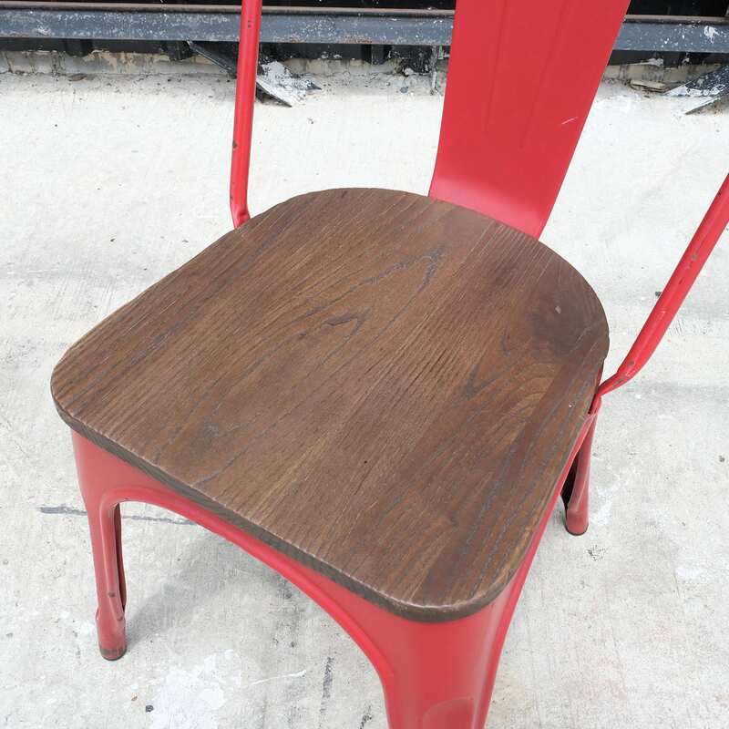 Red steel frame chair with wooden cushion