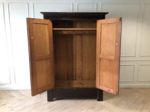 Wooden wardrobe with 2 opening doors, European workmanship, sourced from Germany.