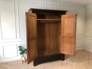 Wooden wardrobe with 2 opening doors, European workmanship, sourced from Germany.