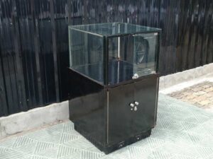 Jewelry cabinet, glass cabinet to display products Square shape, black wooden base, has 2 storage cabinets that open.