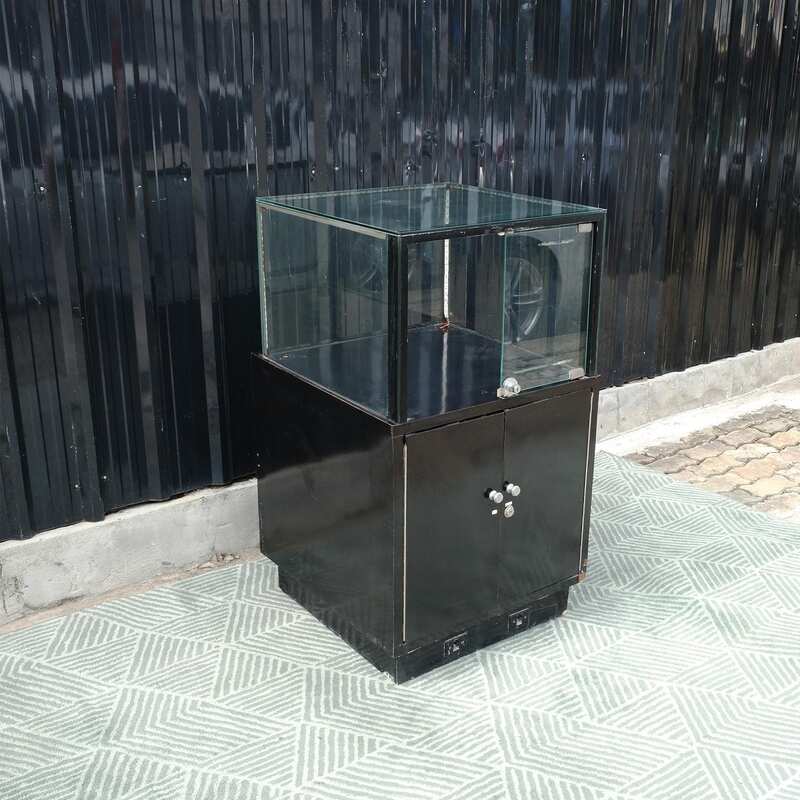 Jewelry cabinet, glass cabinet to display products Square shape, black wooden base, has 2 storage cabinets that open.