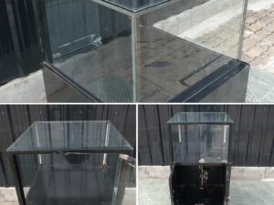 Jewelry cabinet, glass cabinet to display products Square shape, black wooden base, has 2 storage cabinets that open.