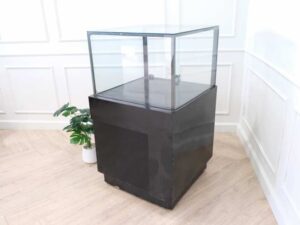 Jewelry cabinet, glass cabinet to display products Square shape, black wooden base, has 2 storage cabinets that open.