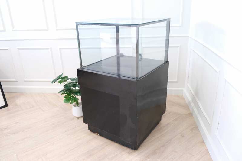 Jewelry cabinet, glass cabinet to display products Square shape, black wooden base, has 2 storage cabinets that open.
