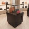 Jewelry cabinet, glass cabinet to display products Square shape, black wooden base, has 2 storage cabinets that open.