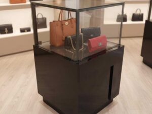 Jewelry cabinet, glass cabinet to display products Square shape, black wooden base, has 2 storage cabinets that open.