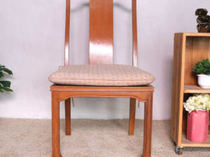Wooden chair, patterned fabric cushion, beautiful frame.