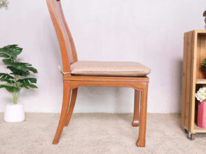 Wooden chair, patterned fabric cushion, beautiful frame.
