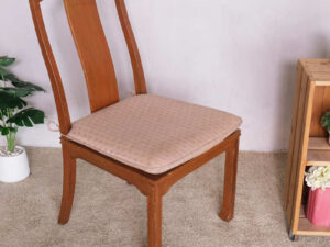 Wooden chair, patterned fabric cushion, beautiful frame.