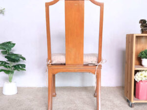 Wooden chair, patterned fabric cushion, beautiful frame.