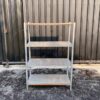 4 shelves, steel frame, wooden top, gray color.