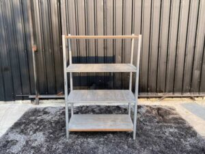 4 shelves, steel frame, wooden top, gray color.