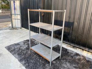 4 shelves, steel frame, wooden top, gray color.