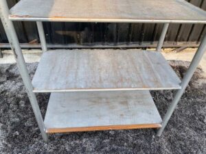 4 shelves, steel frame, wooden top, gray color.