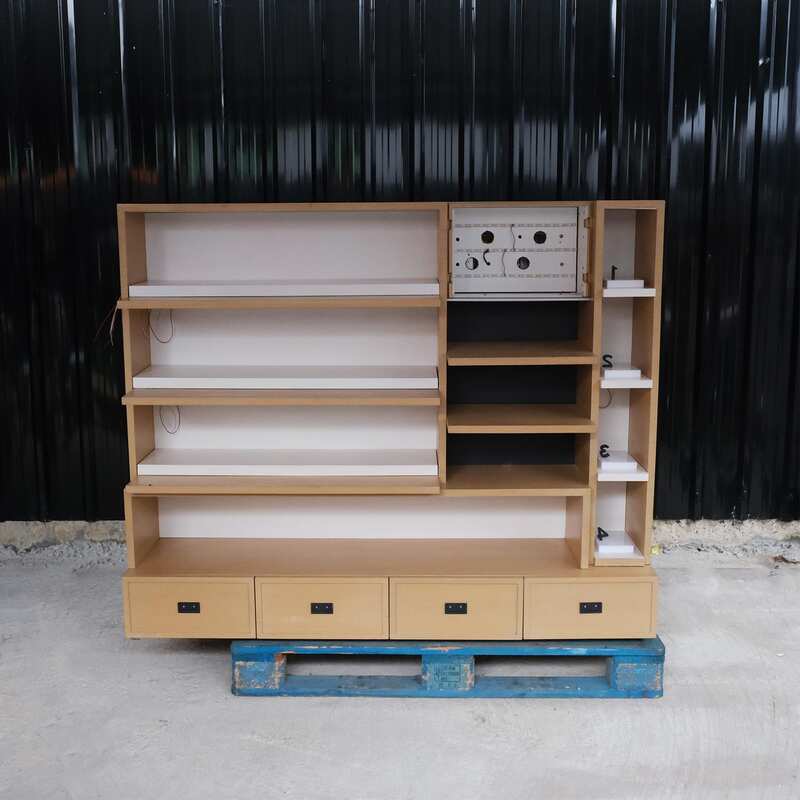 Product shelves, 2 sides, brown wooden frame. The bottom has 4 storage drawers on each side.