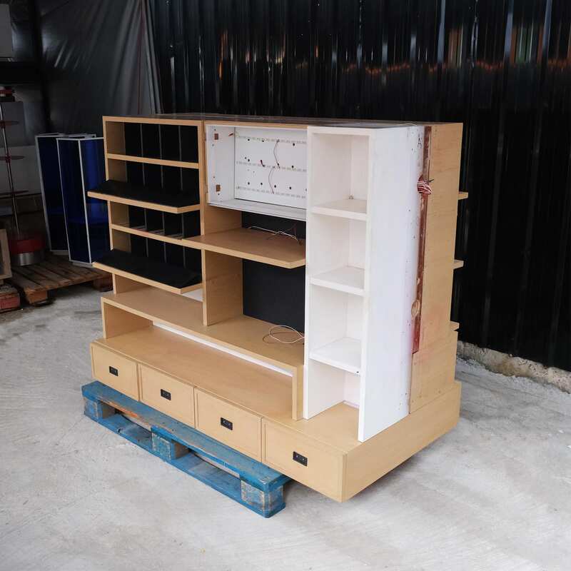 Product shelves, 2 sides, brown wooden frame. The bottom has 4 storage drawers on each side.