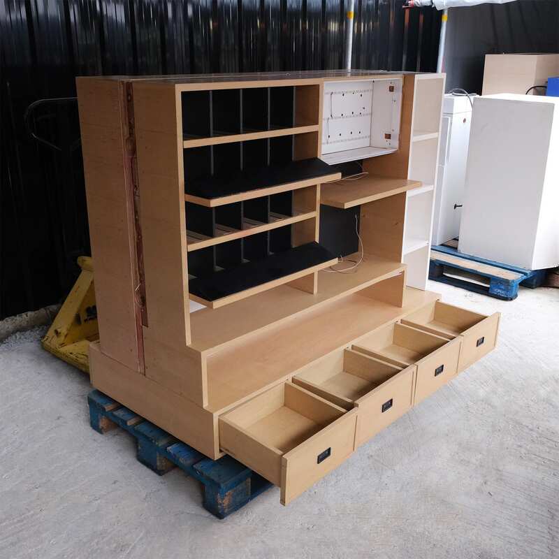 Product shelves, 2 sides, brown wooden frame. The bottom has 4 storage drawers on each side.
