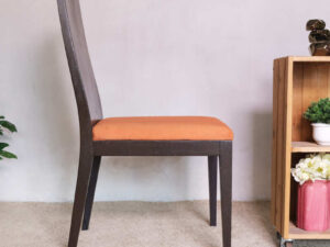 Wooden chair, orange fabric cushion, beautiful frame, slightly curved backrest.