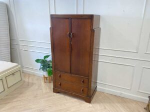 Wooden wardrobe with 2 doors, wooden frame, brown color.
