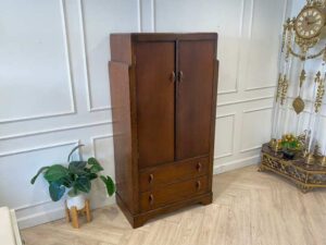 Wooden wardrobe with 2 doors, wooden frame, brown color.