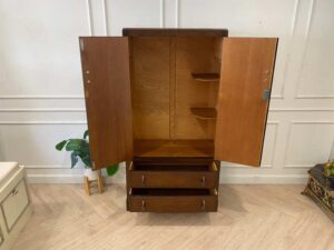 Wooden wardrobe with 2 doors, wooden frame, brown color.
