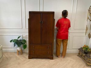 Wooden wardrobe with 2 doors, wooden frame, brown color.