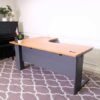 L-shaped corner work desk, brown wood top, gray steel legs, Rockworth brand.