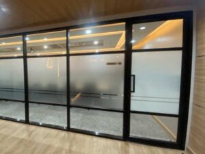 Glass door, blackened aluminum frame
