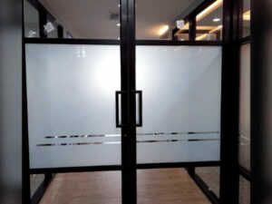 Glass door, blackened aluminum frame