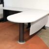 Executive desk, L-shaped corner, light gray wood top, steel legs, has a steel plate to shield the view under the desk, brand UB.