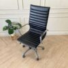 Office chair with black leather upholstery, high back, steel frame, steel arms and legs, adjustable height-low.