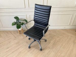 Office chair with black leather upholstery, high back, steel frame, steel arms and legs, adjustable height-low.