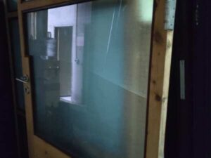 Wooden door with glass window (no key / no door closer)