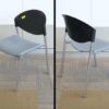 Gray poly cushion chair, black poly backrest, steel frame.