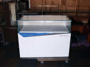 Jewelry cabinet, glass cabinet to display products Rectangular shape glass door open White wooden base with blue stripes