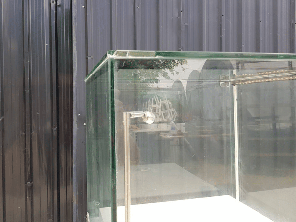 Jewelry cabinet, glass cabinet to display products Tall, square shape glass door open Gray stone pattern wood base