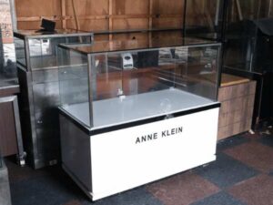 Jewelry cabinet, glass cabinet to display products Rectangular shape glass door open White wooden base with black trim
