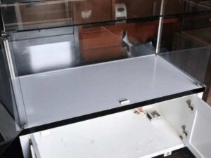 Jewelry cabinet, glass cabinet to display products Rectangular shape glass door open White wooden base with black trim