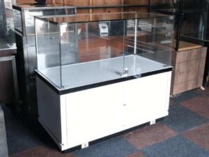 Jewelry cabinet, glass cabinet to display products Rectangular shape glass door open White wooden base with black trim