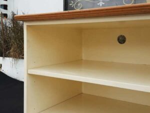 Cream colored 3tier TV stand with wooden top and metal legs