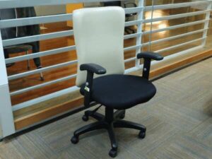office chair Cream leather backrest, black cloth cushion, with arms.
