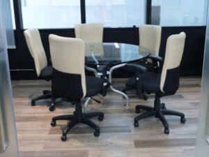 office chair Cream leather backrest, black cloth cushion, with arms.